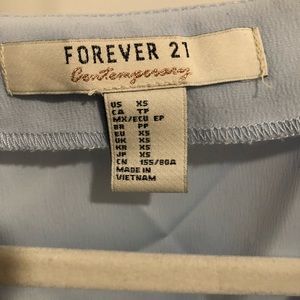 Sleeveless baby blue blouse